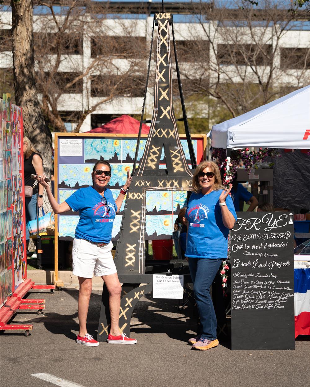 Frye Elementary School stands by the Eiffel Tower their students built in the brand-new STEM lab.